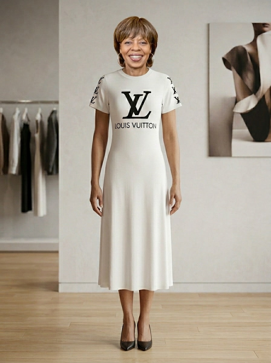Woman wearing a white dress with black logo in a store setting