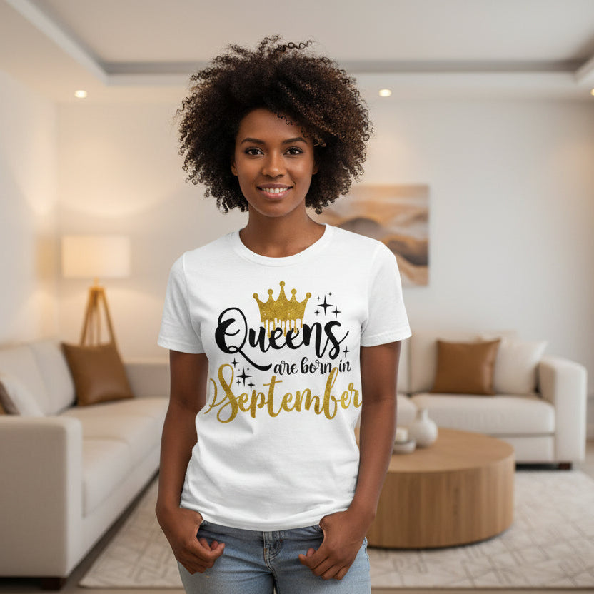 White t-shirt with 'Queens are born in September' text and gold crown graphic on a white background.