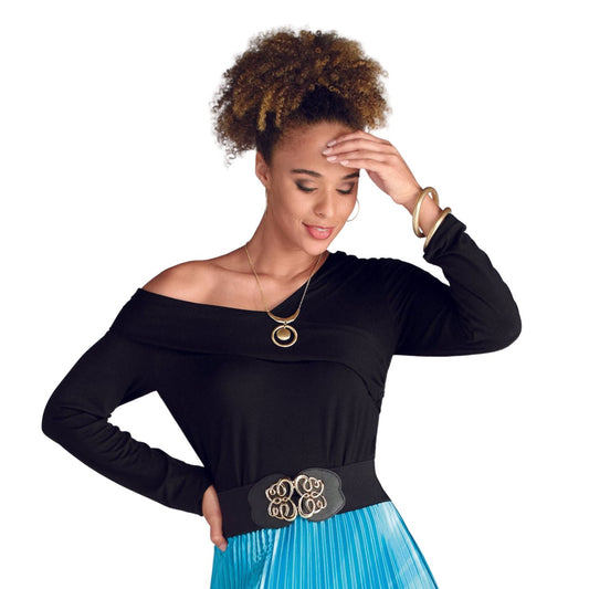 Woman wearing a black off-shoulder top with a blue pleated skirt on a white background