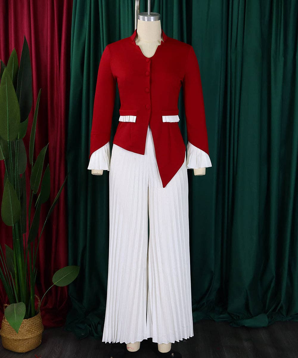 Red jacket and white pleated skirt on a mannequin against a green curtain background