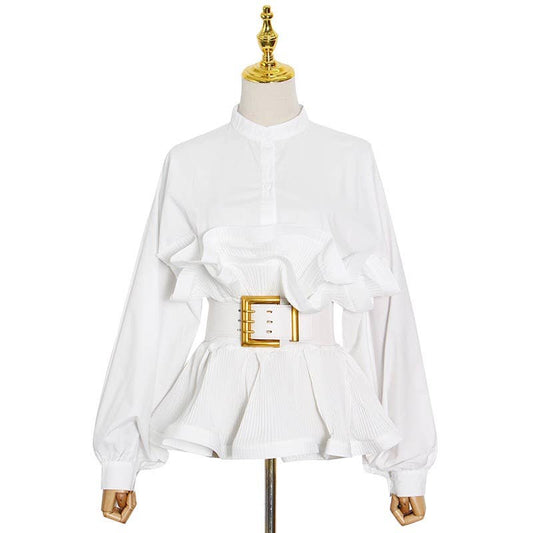White blouse with a gold belt on a mannequin against a white background