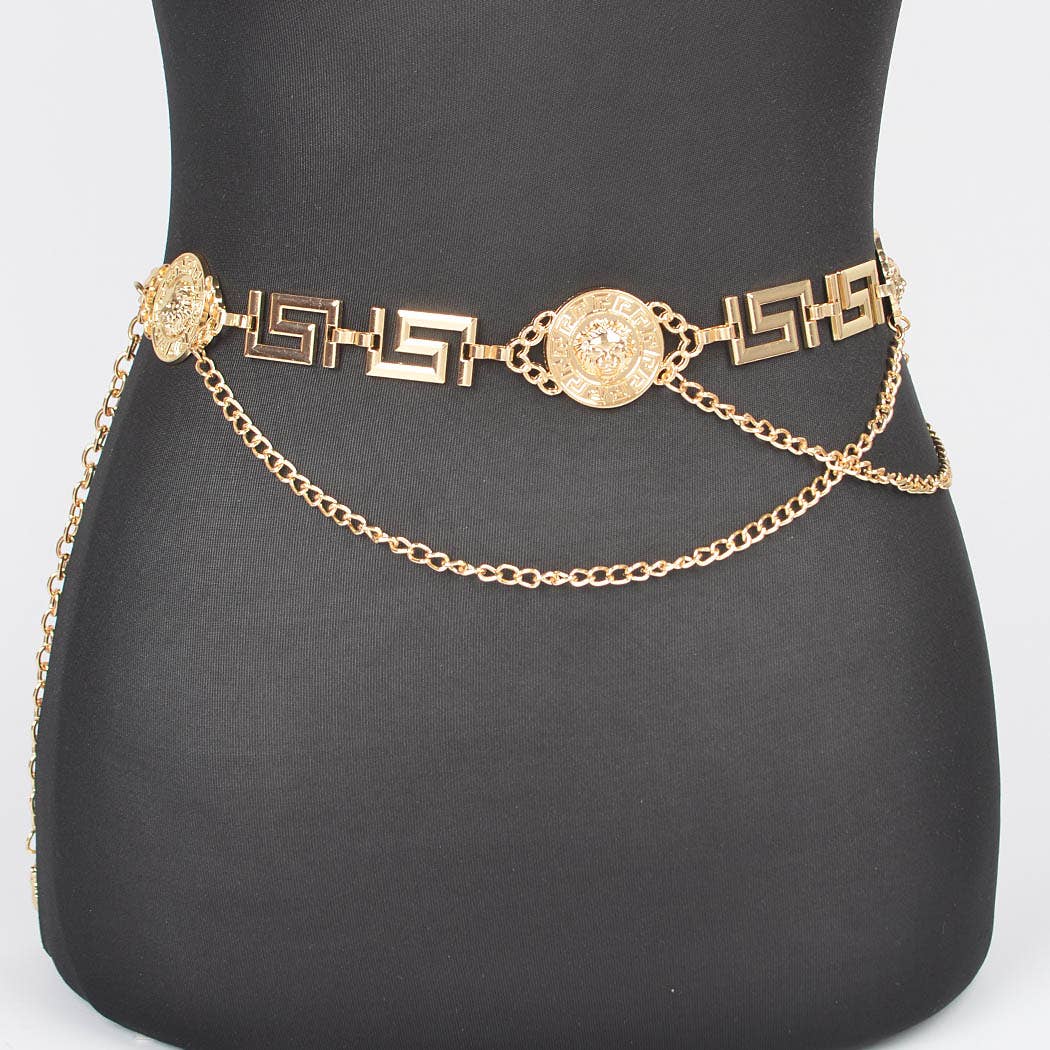 Gold chain belt on a black mannequin with a plain background