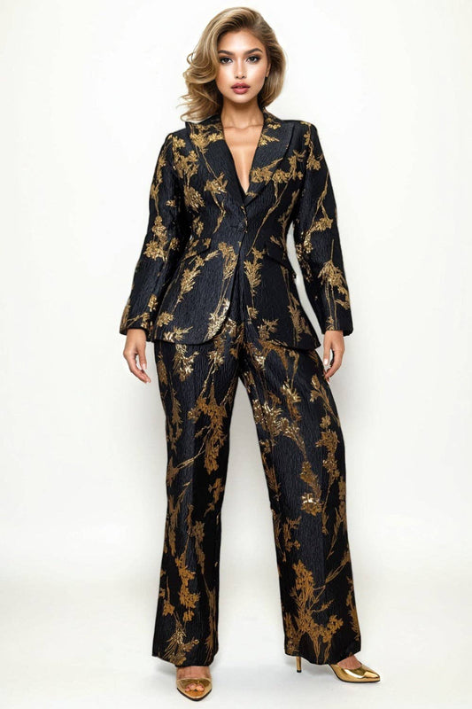 Woman wearing a black and gold patterned suit on a white background