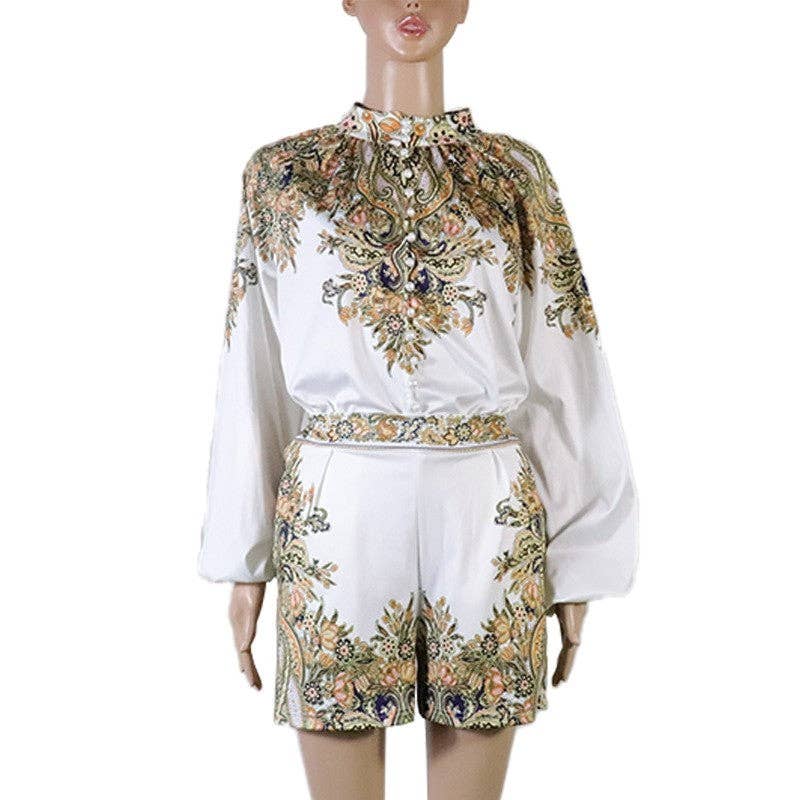 Mannequin wearing a white outfit with floral embroidery on a white background