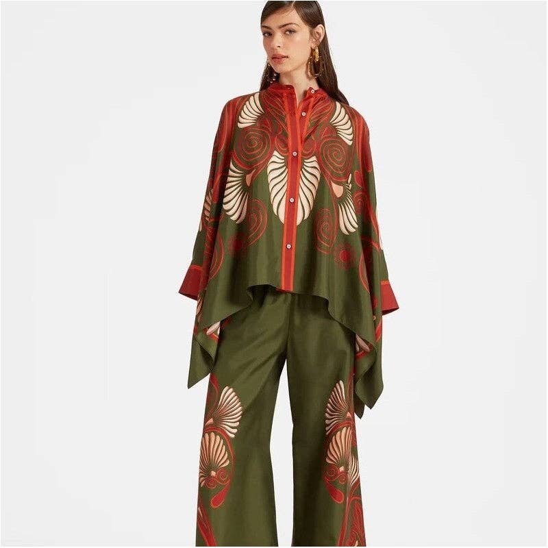 Woman wearing a green and red patterned outfit on a white background