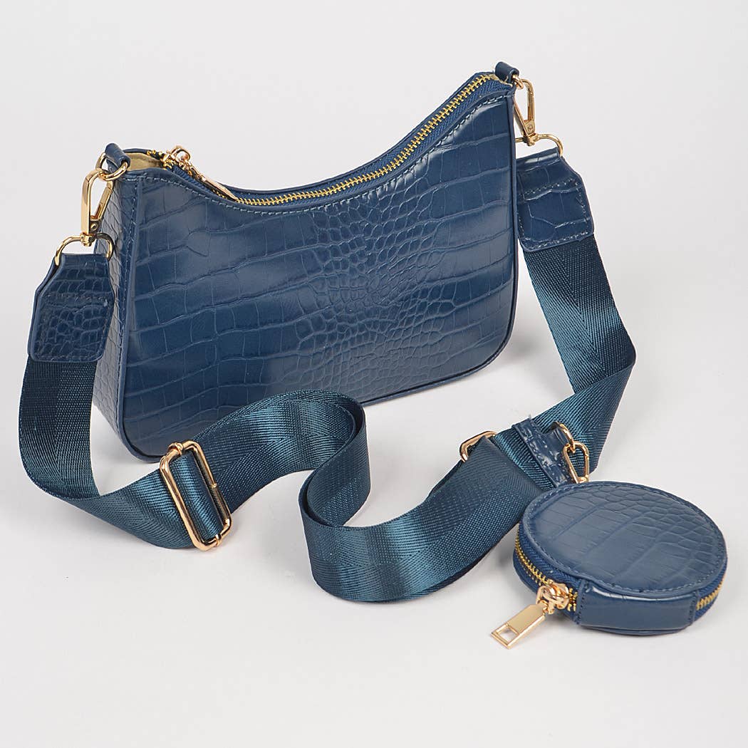 Blue crocodile-patterned handbag with matching coin purse on a white background
