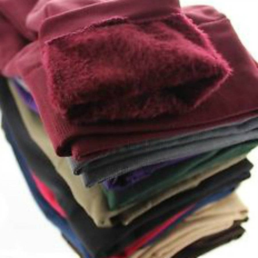 Stack of folded colorful towels on a white background