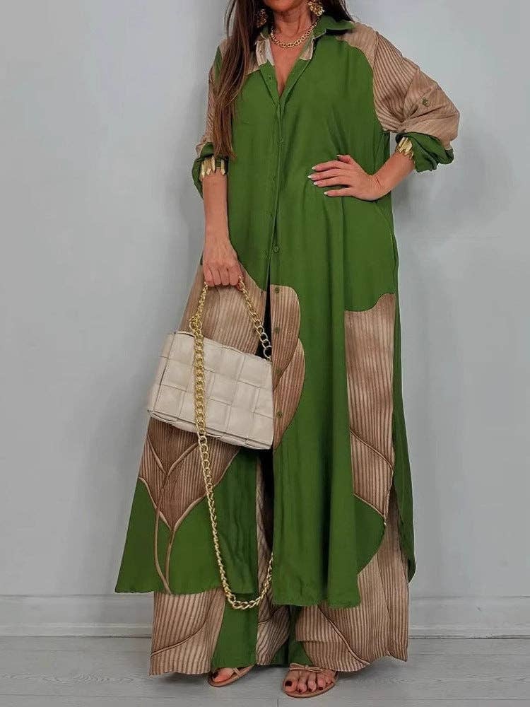 Woman wearing a green and beige dress holding a white handbag against a plain background