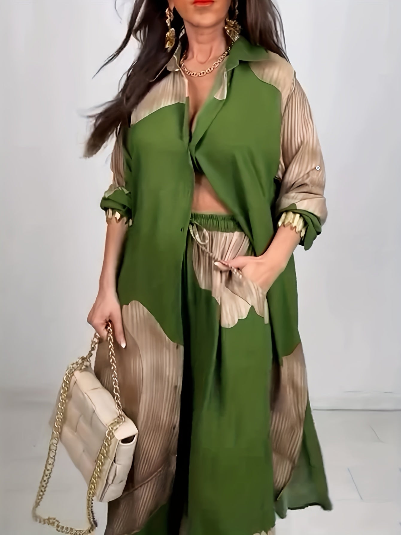 Woman wearing a green and beige outfit with a white background