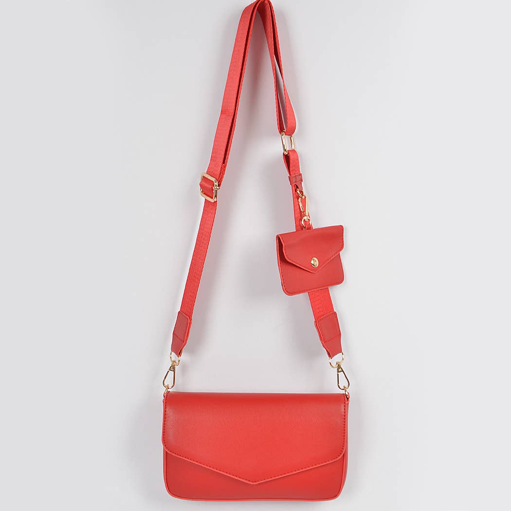 Red handbag with a matching pouch on a light gray background