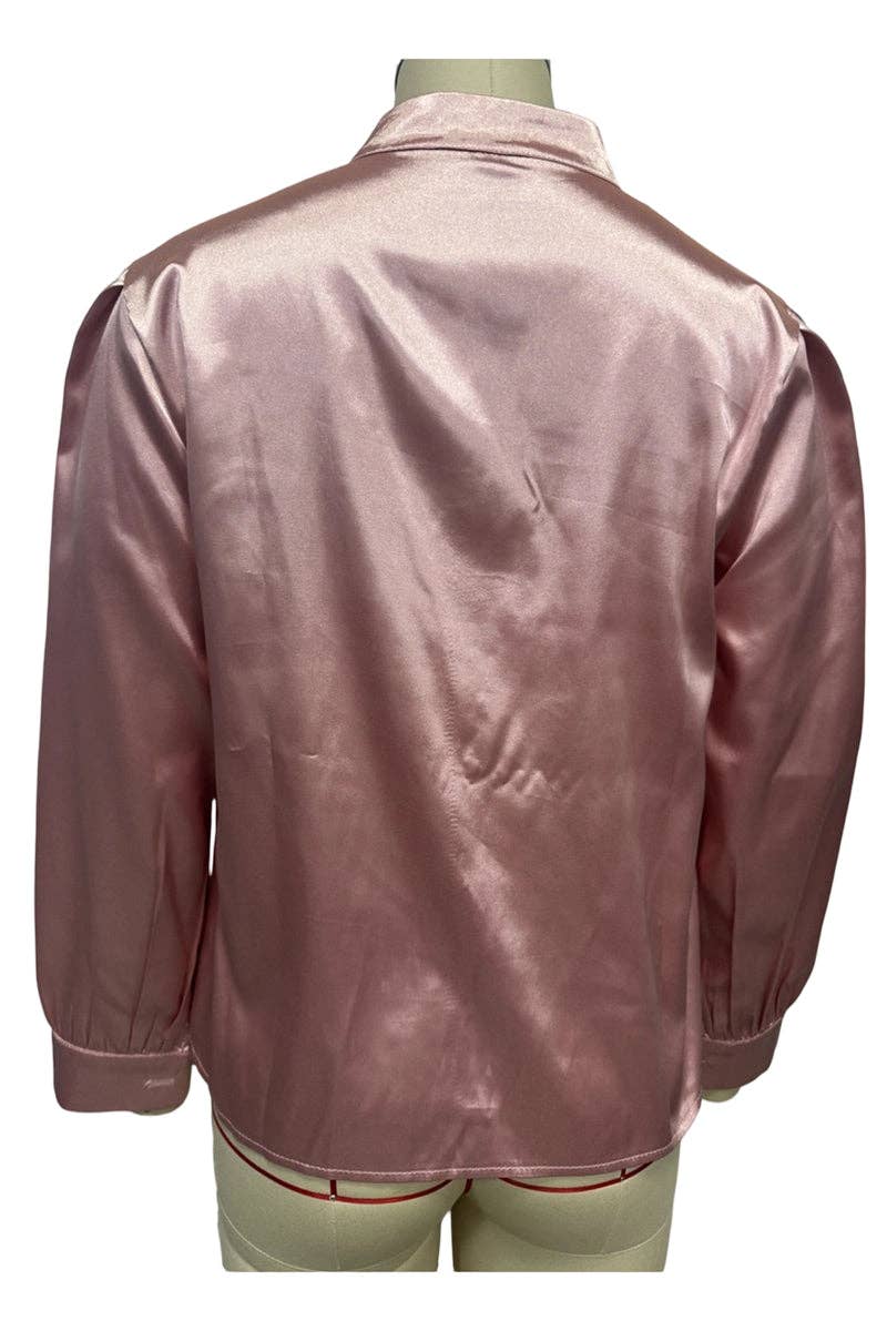 Pink satin jacket on a mannequin against a white background