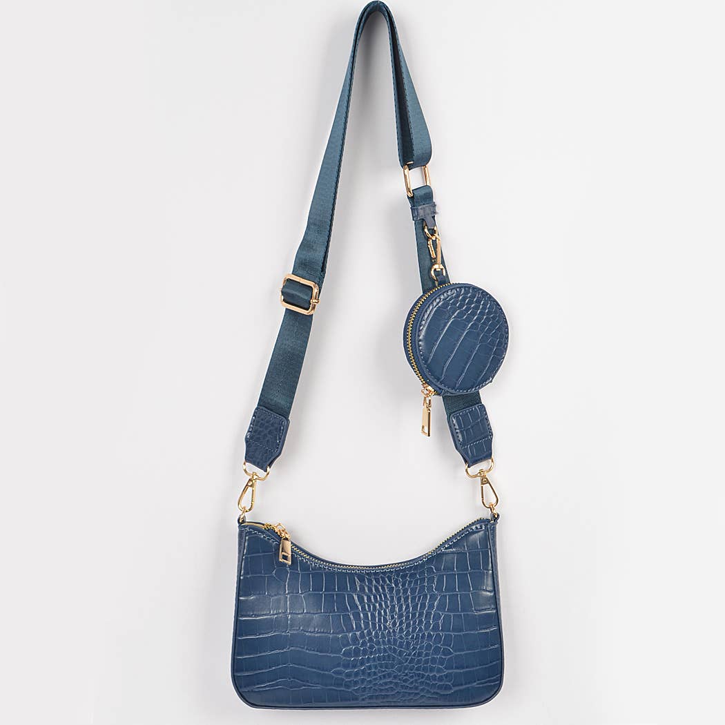 Blue textured handbag with matching round pouch on a white background