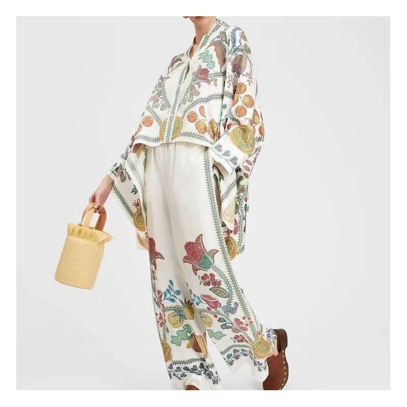 Person wearing a floral outfit with a white background