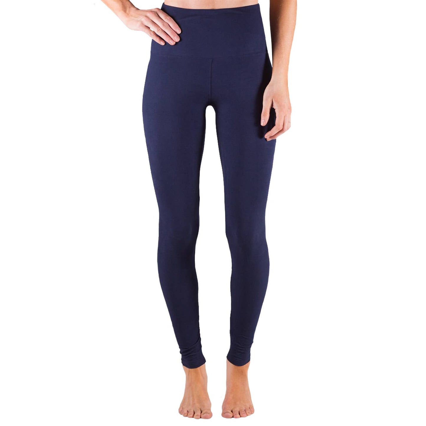 Navy blue leggings worn by a person on a white background