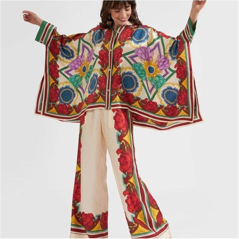 Woman wearing a colorful floral patterned outfit on a white background
