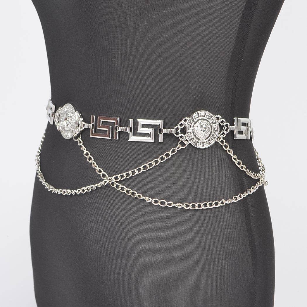 Silver chain belt with decorative elements on a mannequin against a white background