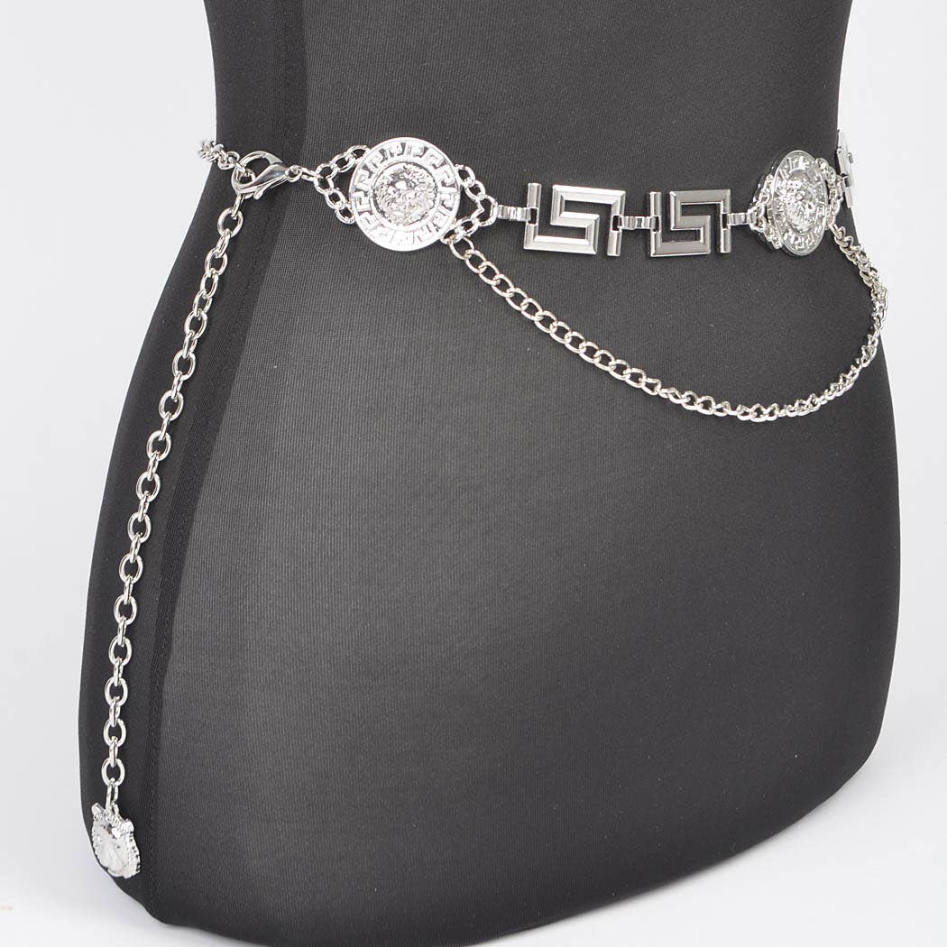 Silver chain belt with decorative elements on a black mannequin.