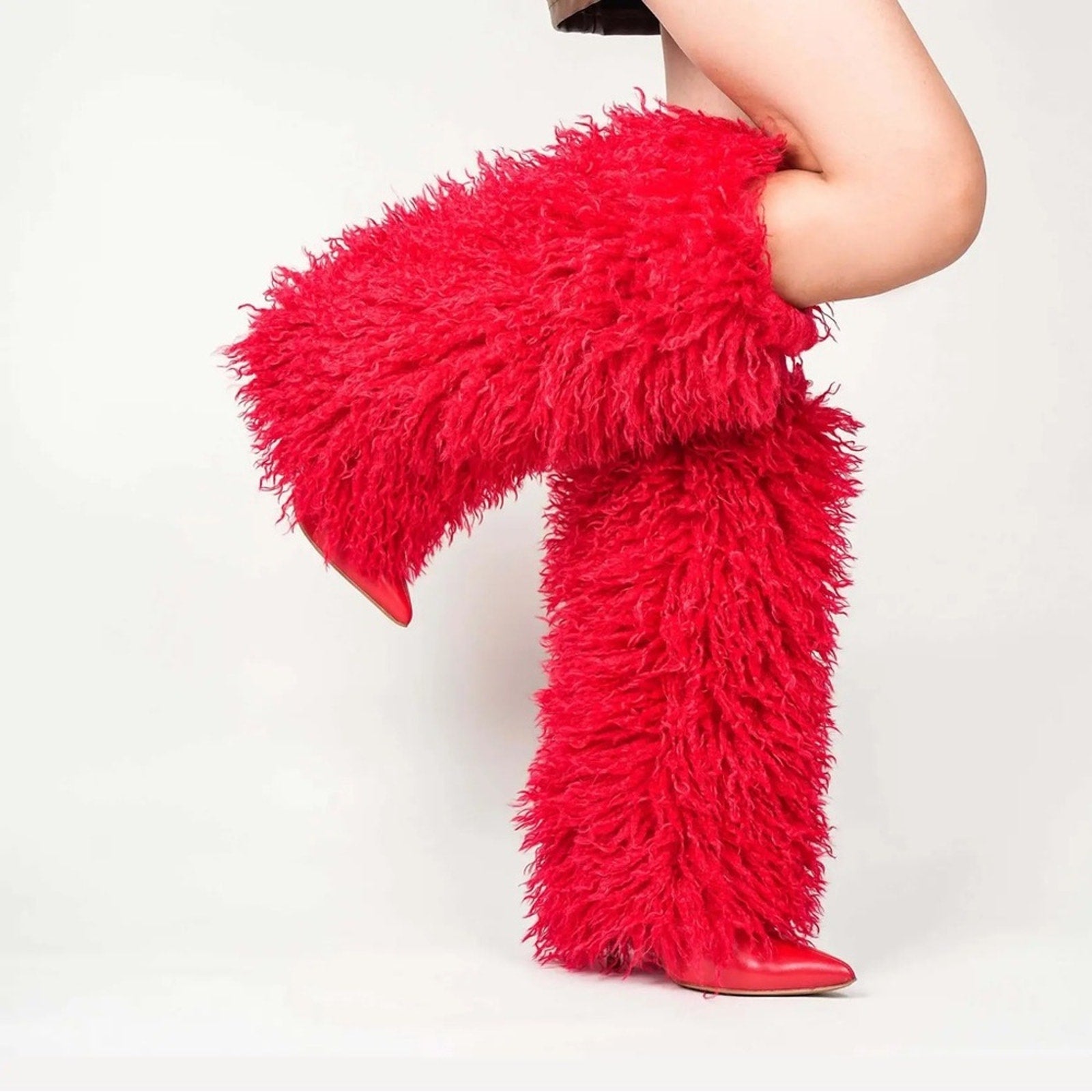 Red furry boots being worn indoors 