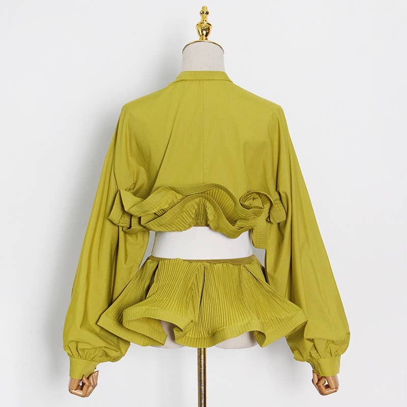 Yellow outfit on a mannequin against a white background