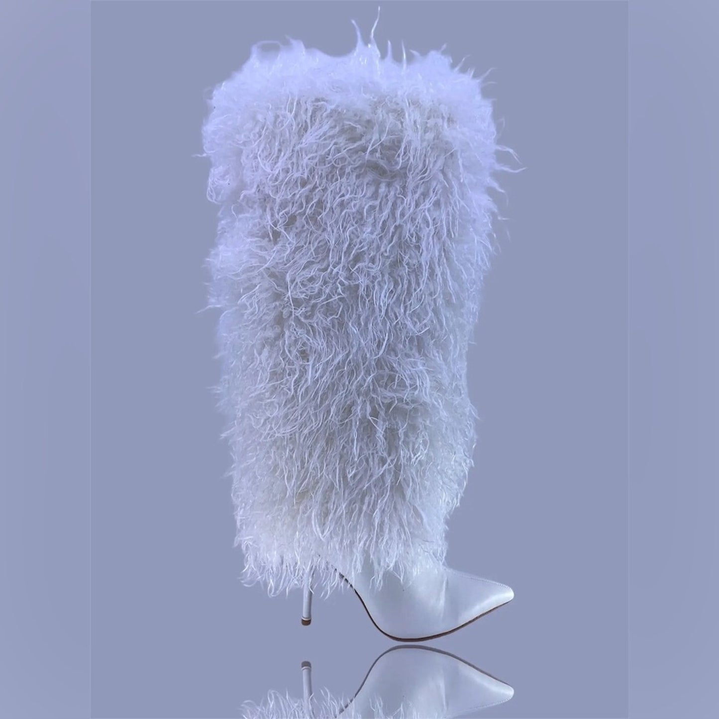 White fluffy hat on a mannequin head against a gray background