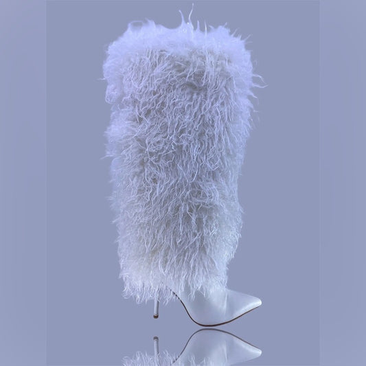 White fluffy hat on a mannequin head against a gray background