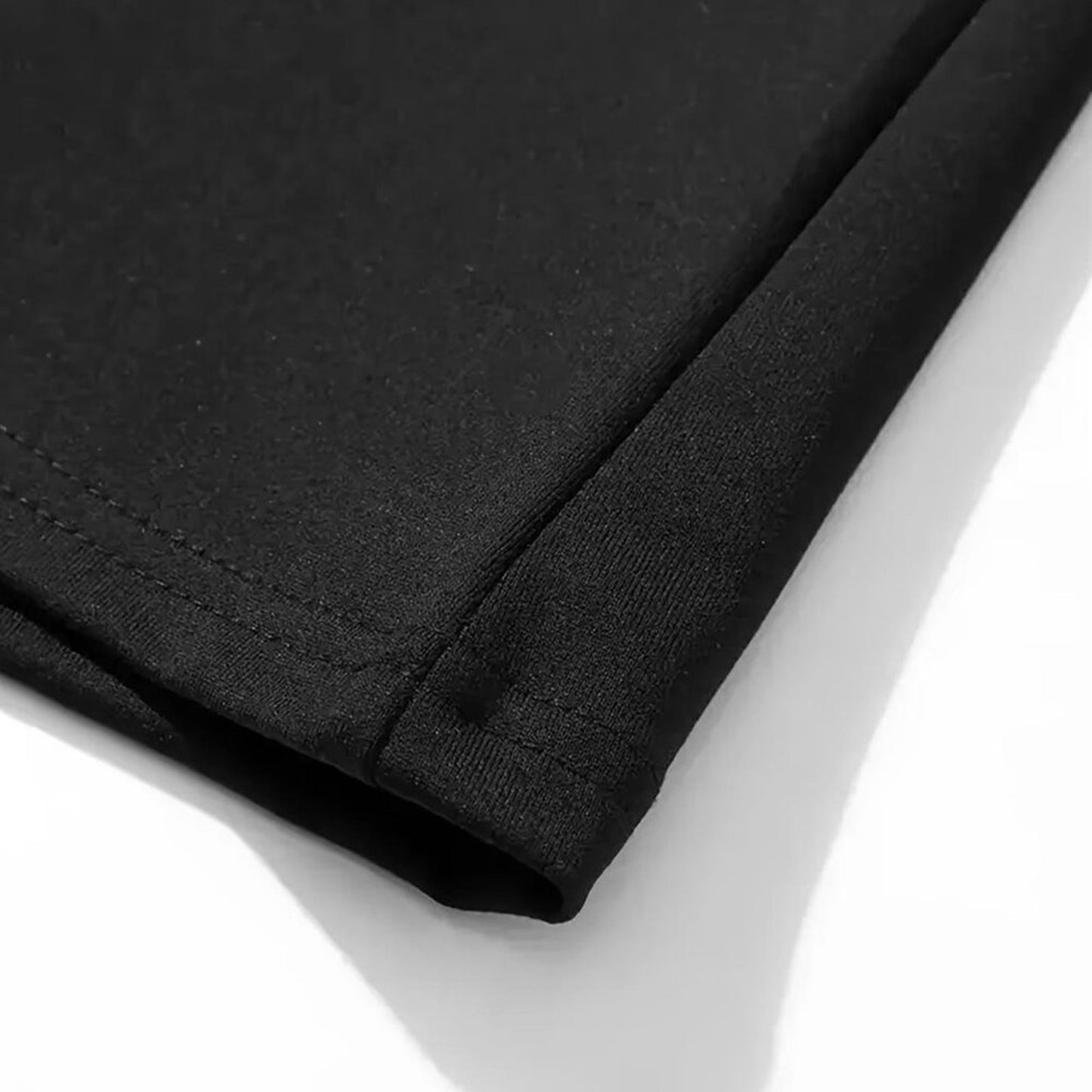 Close-up of black fabric on a white background