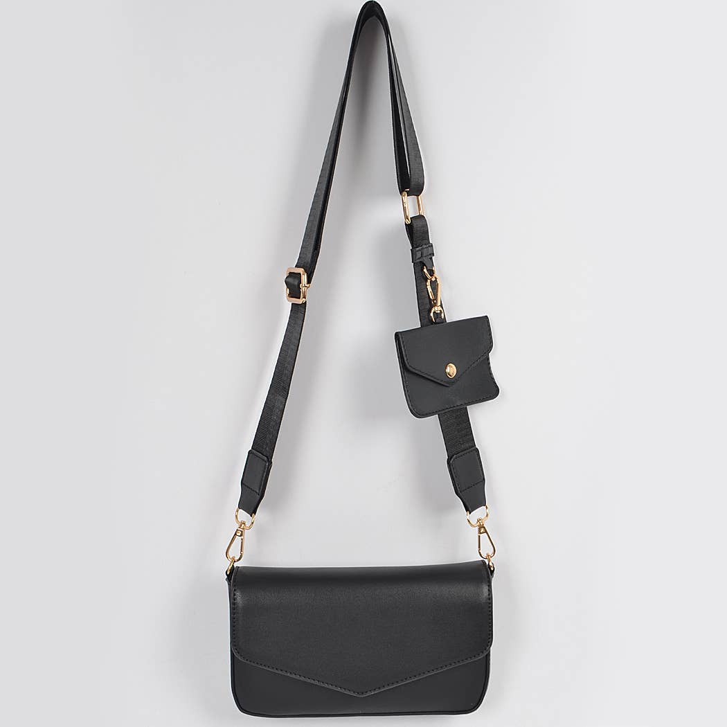 Black crossbody bag with a small pouch on a light gray background