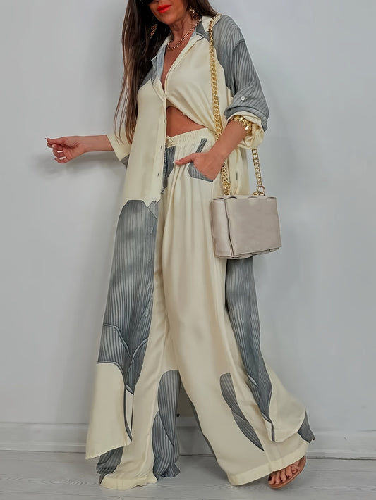 Woman wearing a stylish outfit with a white and gray patterned shirt and pants, holding a beige handbag against a plain background.