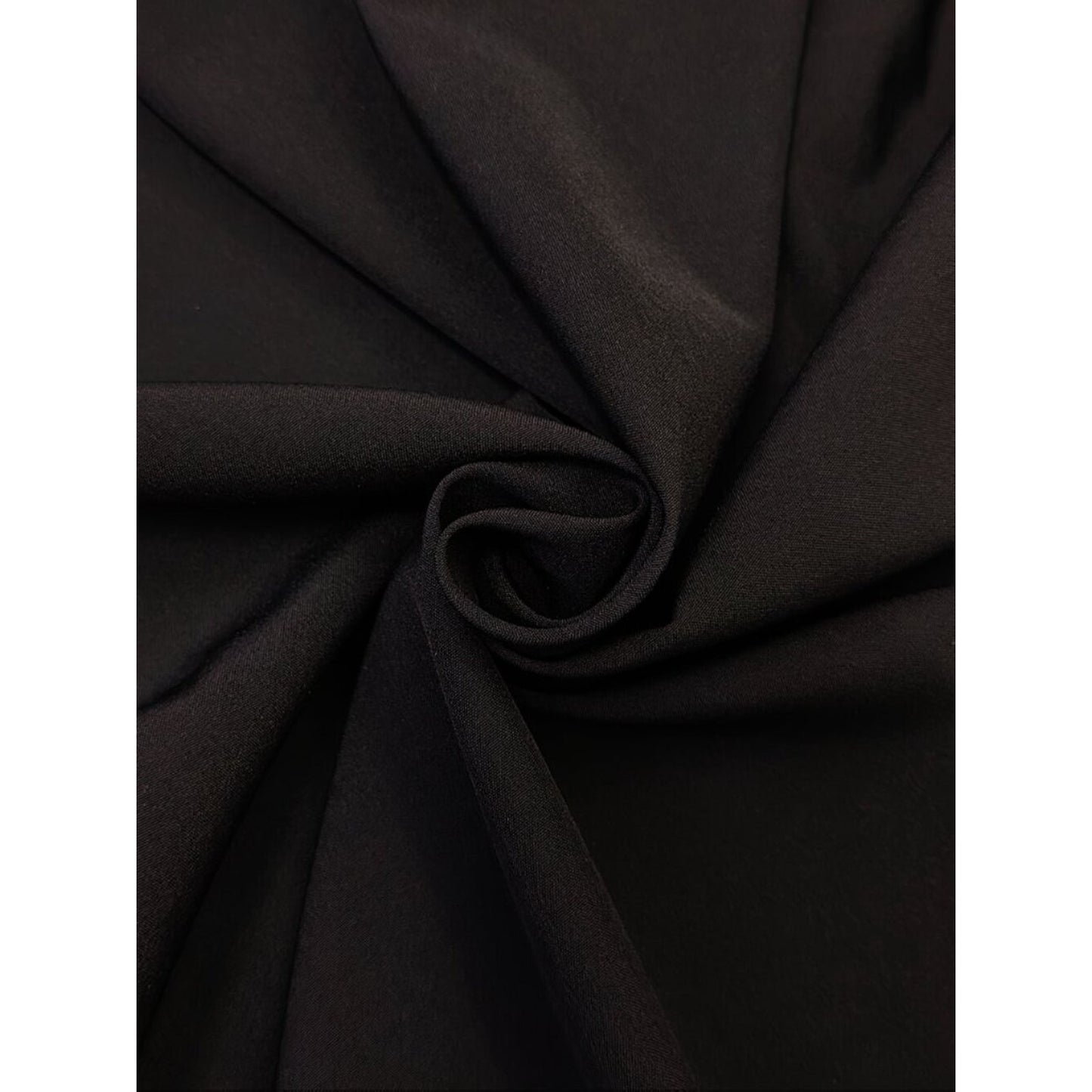 Close-up of dark brown fabric with folds