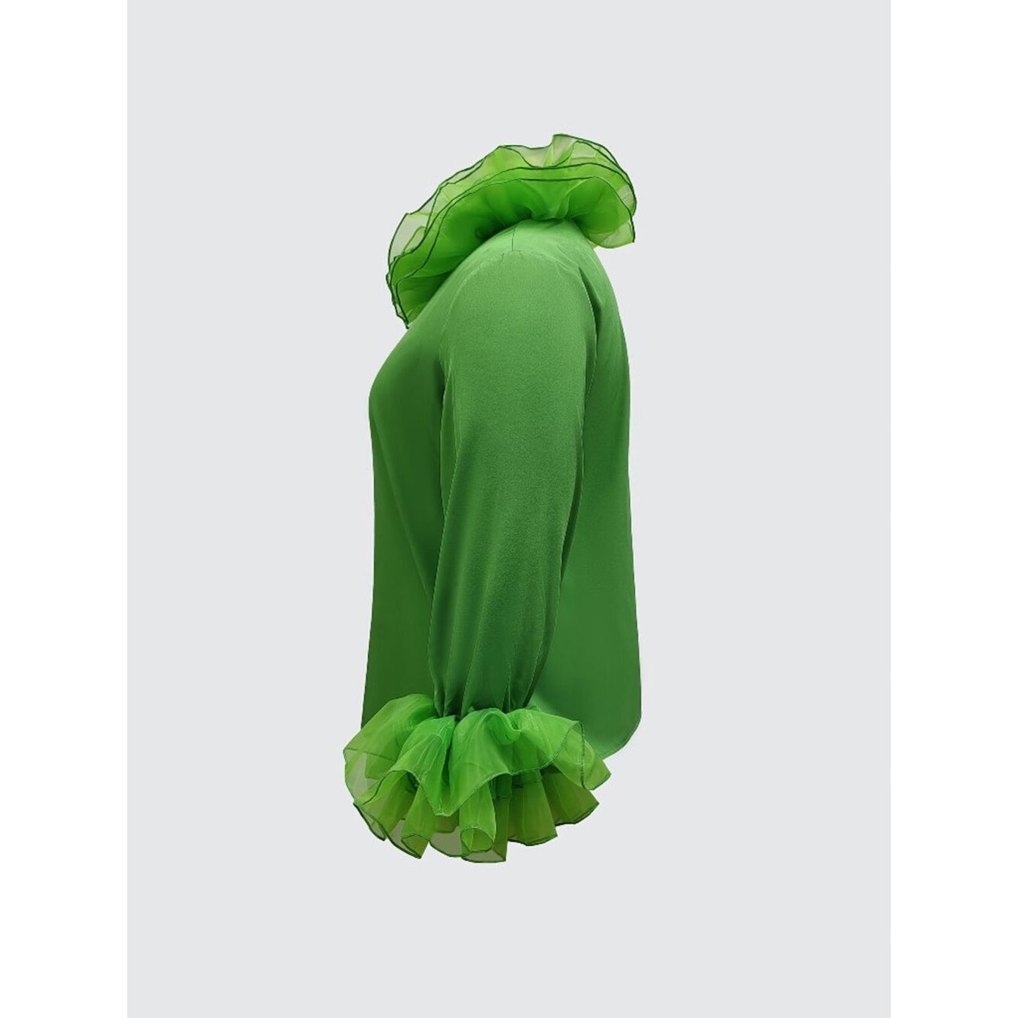 Green dress with ruffled details on a white background
