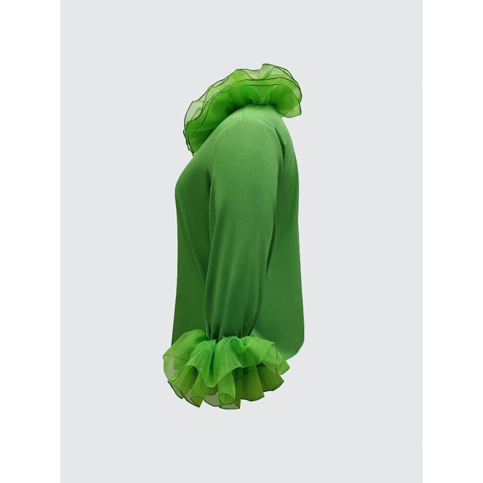 Green dress with ruffled details on a white background