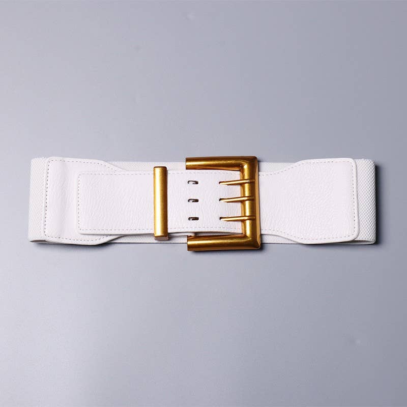White belt with a gold buckle on a gray background