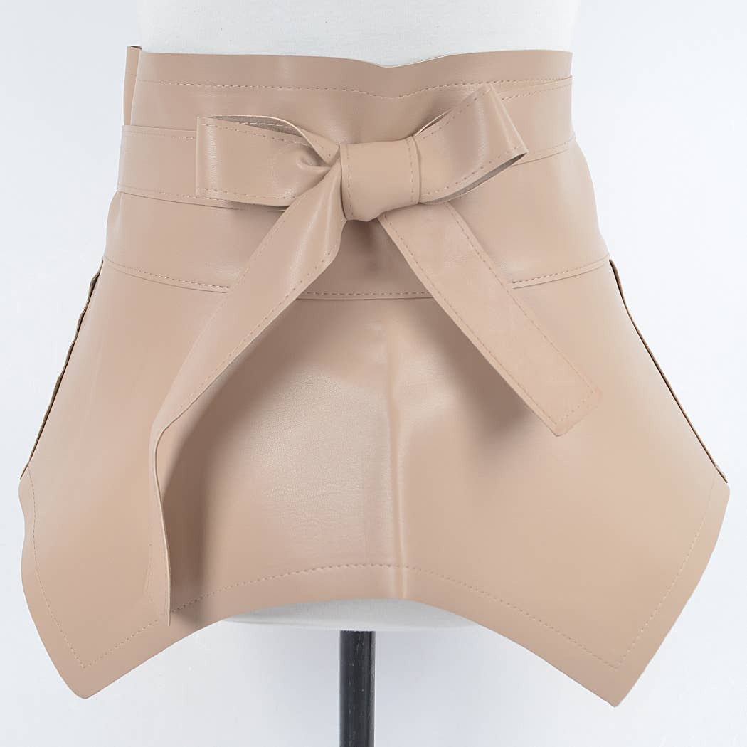 Beige leather skirt with a bow on a white background