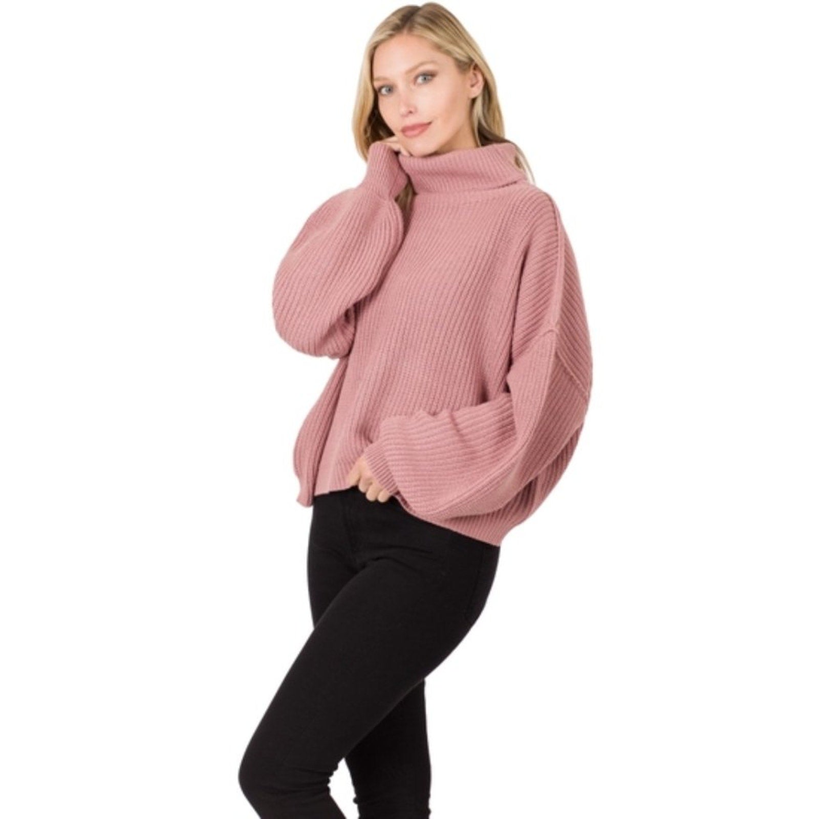 Woman wearing a pink sweater on a white background