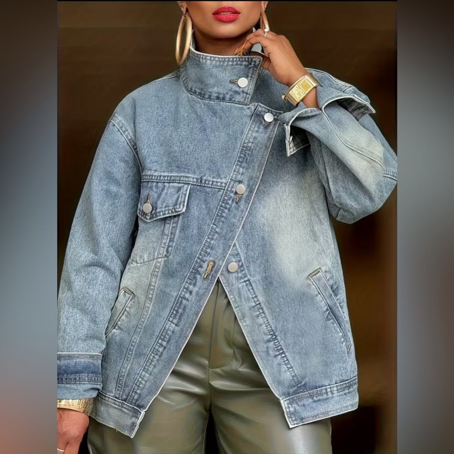 Person wearing a light blue denim jacket with a blurred background