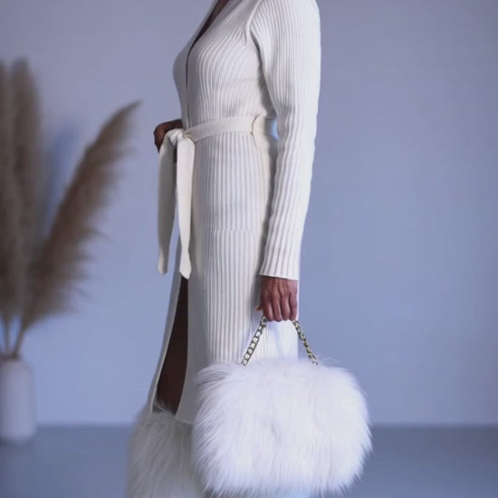 Video styling a white pair of fur boots 