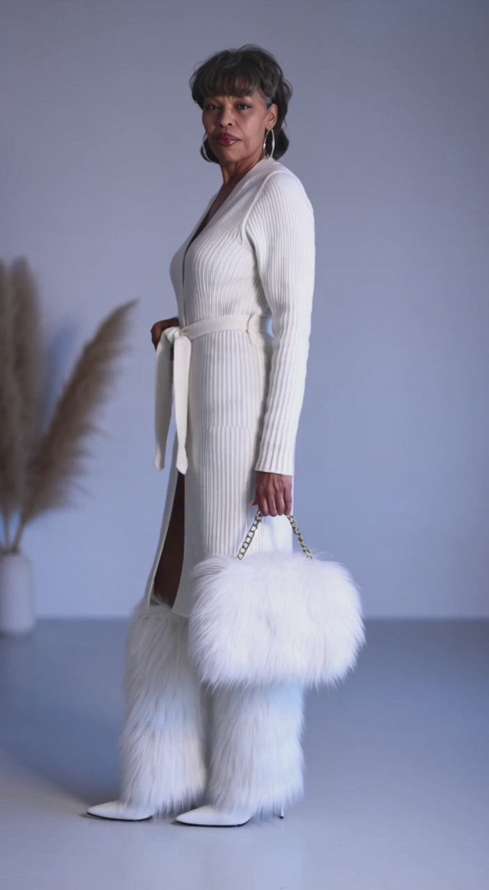 Video styling a white pair of fur boots 