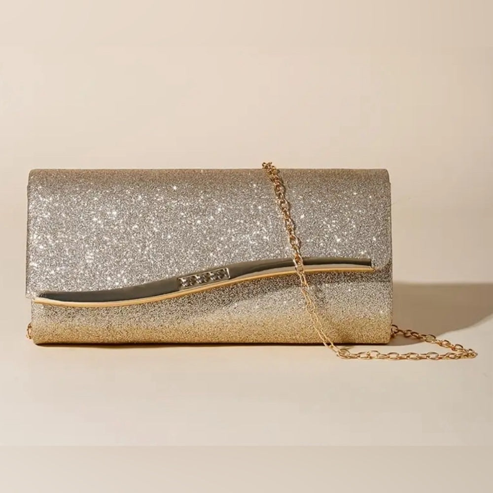 Sparkly clutch bag with a gold chain on a beige background