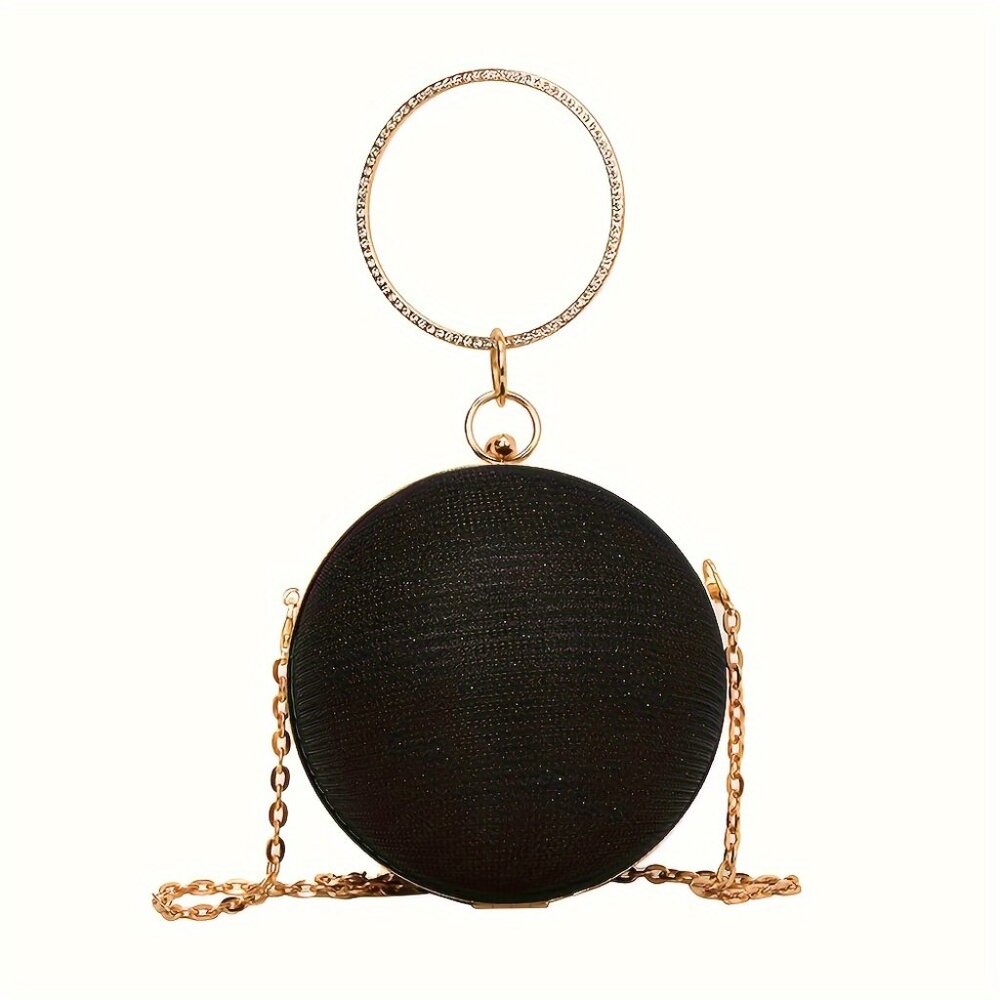 Black round clutch with gold chain and ring handle on a white background