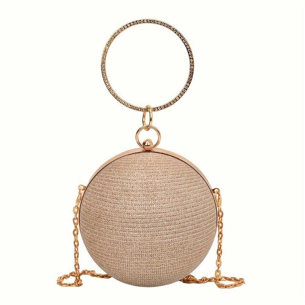 Round beige handbag with gold chain and handle on a white background