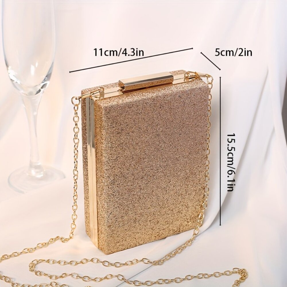 Gold glitter clutch bag with chain strap and measurements on a white background
